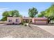 Charming single-story home featuring desert landscaping and a two-car garage for convenient parking at 17705 E Canyon Way, Gilbert, AZ 85298