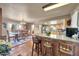 A kitchen with tile floors, light wood cabinets, and a large island perfect for Gathering meals at 17705 E Canyon Way, Gilbert, AZ 85298