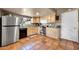 Functional kitchen features stainless steel appliances and light wood cabinets for storage at 17705 E Canyon Way, Gilbert, AZ 85298