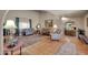 An open living room features tile flooring, neutral paint, and arched entry to the kitchen area at 17705 E Canyon Way, Gilbert, AZ 85298