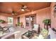 A covered patio with comfortable seating and ceiling fans, perfect for enjoying the outdoors at 17705 E Canyon Way, Gilbert, AZ 85298