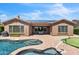 Stunning backyard featuring a pool, spa, and putting green, perfect for outdoor entertaining and relaxation with desert views at 1805 W Dusty Wren Dr, Phoenix, AZ 85085