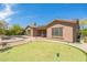 Lush backyard featuring a putting green, patio, and pool, creating an ideal outdoor living space for recreation and relaxation at 1805 W Dusty Wren Dr, Phoenix, AZ 85085