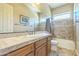 Bathroom with a single sink vanity, and shower-tub combo at 1805 W Dusty Wren Dr, Phoenix, AZ 85085