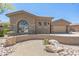 Charming single-story home with desert landscaping, stone accents, and an attached two-car garage at 1805 W Dusty Wren Dr, Phoenix, AZ 85085