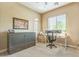 Well-lit home office with a murphy bed and ample storage space at 1805 W Dusty Wren Dr, Phoenix, AZ 85085
