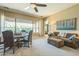 Inviting living room with large windows, neutral tones, and comfortable seating for relaxing at 1805 W Dusty Wren Dr, Phoenix, AZ 85085