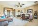 Open-concept living area with a stone archway, comfortable seating, and stylish decor at 1805 W Dusty Wren Dr, Phoenix, AZ 85085