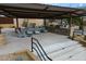 Community outdoor kitchen and seating area equipped with a grill, counter space, and comfortable seating at 1805 W Dusty Wren Dr, Phoenix, AZ 85085