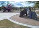 Community playground featuring climbing structures, slides, and ample space for children to enjoy outdoor activities at 1805 W Dusty Wren Dr, Phoenix, AZ 85085