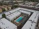 An aerial shot showcasing the complex's layout, including a central pool and communal areas at 18202 N Cave Creek Rd # 122, Phoenix, AZ 85032