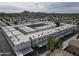 Overhead view of a multi-unit complex with parking; landscape featuring desert and mountain views at 18202 N Cave Creek Rd # 122, Phoenix, AZ 85032