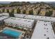 Aerial view of a well-maintained apartment complex with a pool and convenient parking at 18202 N Cave Creek Rd # 122, Phoenix, AZ 85032