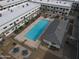 Aerial view of a community pool and picnic area surrounded by apartment buildings at 18202 N Cave Creek Rd # 122, Phoenix, AZ 85032