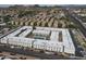 Aerial shot showing the layout of apartments with a pool and community areas, near local amenities at 18202 N Cave Creek Rd # 122, Phoenix, AZ 85032