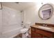 Bathroom with a single sink vanity, a tile countertop and a shower-tub combo at 18202 N Cave Creek Rd # 122, Phoenix, AZ 85032