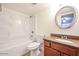 Bright bathroom featuring a shower-tub combo and granite countertops at 18202 N Cave Creek Rd # 122, Phoenix, AZ 85032