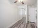 Bright bedroom with a closet with sliding mirrored doors and wood-style flooring at 18202 N Cave Creek Rd # 122, Phoenix, AZ 85032