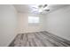 This bedroom features wood-look floors, a window, and ample natural light at 18202 N Cave Creek Rd # 122, Phoenix, AZ 85032