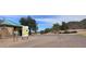 Entrance to Buffalo Ridge Park with signs, paved parking, desert landscaping, and distant mountain views at 18202 N Cave Creek Rd # 122, Phoenix, AZ 85032