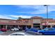 Facade of a bustling shopping center with multiple stores; ample parking and street view shown at 18202 N Cave Creek Rd # 122, Phoenix, AZ 85032