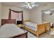 Comfortable bedroom featuring two beds, ceiling fan, curtains, and a mirrored closet at 18845 N 23Rd Pl, Phoenix, AZ 85024