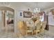Charming dining area featuring a chandelier and elegant furnishings, perfect for Gathering meals and gatherings at 18845 N 23Rd Pl, Phoenix, AZ 85024