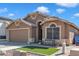 Charming single-story home with a well-manicured front yard and a cozy bench, showcasing curb appeal at 18845 N 23Rd Pl, Phoenix, AZ 85024