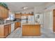 Bright kitchen with island, granite counters, stainless appliances, and ample cabinet space at 18845 N 23Rd Pl, Phoenix, AZ 85024
