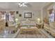 Comfortable living space with elegant furniture, neutral tones, and a ceiling fan, creating a cozy and stylish retreat at 18845 N 23Rd Pl, Phoenix, AZ 85024