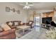 Spacious living room features a ceiling fan and sliding door access to the backyard at 18845 N 23Rd Pl, Phoenix, AZ 85024
