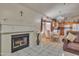 Cozy living room features a fireplace, and view to the dining area and kitchen at 18845 N 23Rd Pl, Phoenix, AZ 85024