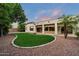 Backyard with desert landscaping, a grassy area, and a covered patio at 19902 S 190Th St, Queen Creek, AZ 85142