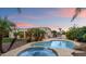 Beautiful backyard pool and spa featuring mature landscaping and patio space at 19902 S 190Th St, Queen Creek, AZ 85142