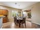 Dining area featuring a large table, chandelier, and sliding glass doors to the outdoor patio at 19902 S 190Th St, Queen Creek, AZ 85142
