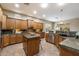 Open kitchen featuring granite countertops, stainless steel appliances, and ample cabinet space at 19902 S 190Th St, Queen Creek, AZ 85142