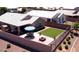 Aerial view of backyard with patio, fire pit, artificial grass, and outdoor seating area at 2070 E Saddlebrook Ct, Gilbert, AZ 85298