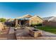 Spacious backyard with a patio, fire pit, and an outdoor seating area at 2070 E Saddlebrook Ct, Gilbert, AZ 85298