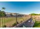 View of the backyard, featuring a fence, gravel, and artificial grass at 2070 E Saddlebrook Ct, Gilbert, AZ 85298
