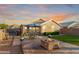 Beautiful backyard featuring a cozy fire pit and outdoor seating area, perfect for entertaining at 2070 E Saddlebrook Ct, Gilbert, AZ 85298