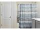 Clean bathroom with a bathtub, shower, and a stylish shower curtain at 2070 E Saddlebrook Ct, Gilbert, AZ 85298