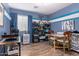Bedroom with blue accents, a large window, and laminate flooring at 2070 E Saddlebrook Ct, Gilbert, AZ 85298