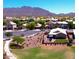 A lovely community view with mountain backdrop and well-maintained lawns on a bright, sunny day at 2070 E Saddlebrook Ct, Gilbert, AZ 85298