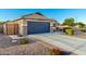 Charming single-Gathering home featuring a two-car garage, desert landscaping, and a well-maintained front yard at 2070 E Saddlebrook Ct, Gilbert, AZ 85298