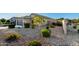 Well-maintained front yard with desert landscaping and healthy green bushes at 2070 E Saddlebrook Ct, Gilbert, AZ 85298