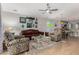 Comfortable living room features tile flooring, ceiling fan and nautical decorations at 2070 E Saddlebrook Ct, Gilbert, AZ 85298