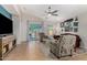 Cozy living room with ceiling fan, patio access and coastal decor at 2070 E Saddlebrook Ct, Gilbert, AZ 85298