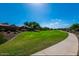 Expansive green space with walking path for outdoor enjoyment and recreation in a well-maintained community at 2070 E Saddlebrook Ct, Gilbert, AZ 85298