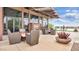 Outdoor patio area with seating, planters, and lake views in a community center at 2070 E Saddlebrook Ct, Gilbert, AZ 85298