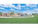 Community playground with various play structures, seating, and a covered picnic area for families to enjoy at 2070 E Saddlebrook Ct, Gilbert, AZ 85298